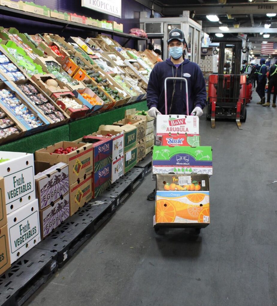 Fadaro Foods employee sourcing wholesale produce at NYC Produce Terminal Market